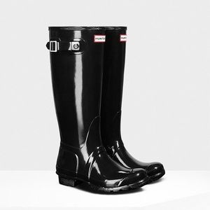 Tall black glossy hunter boots